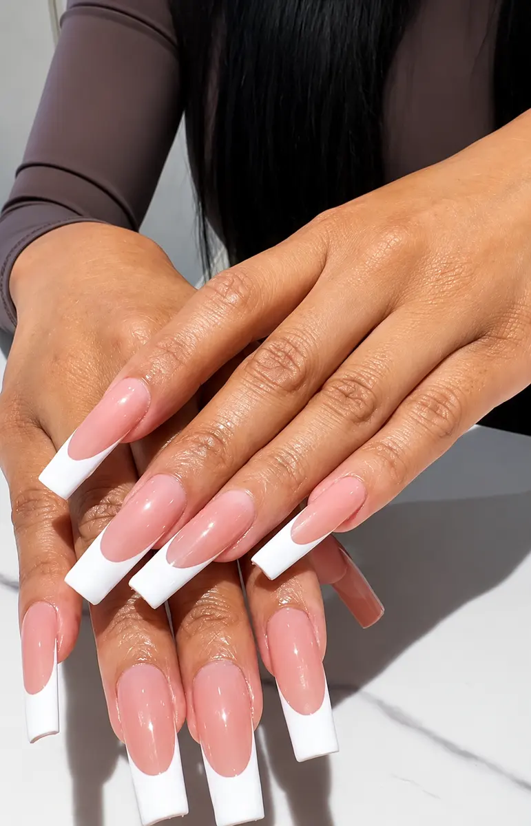 Extra-long coffin nails with a classic white French tip
